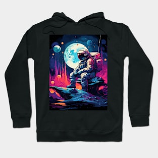 an astronaut sitting on a planet Hoodie